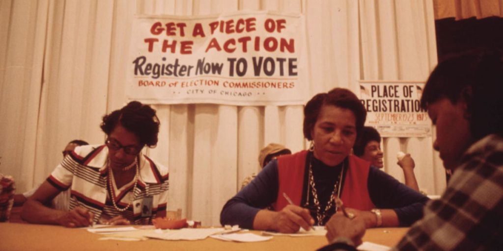 image of women registering people to vote